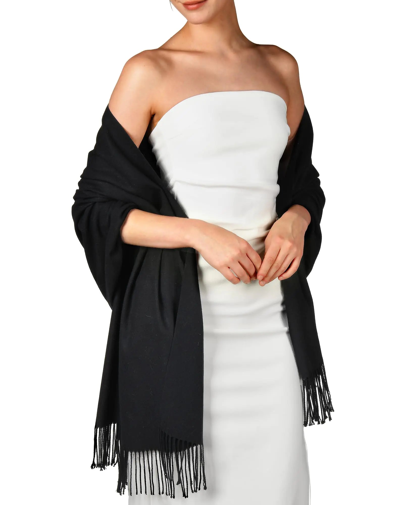 a woman wearing a white dress and black shawl