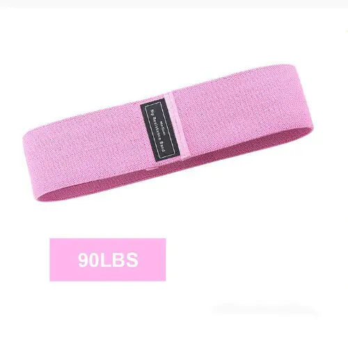 a pink headband with a black label on it
