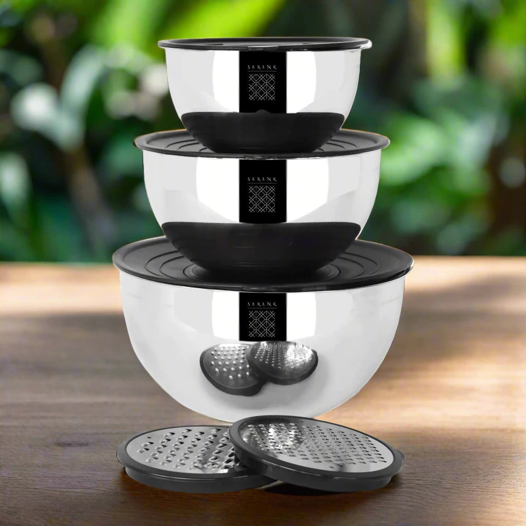 a stack of three bowls sitting on top of a wooden table