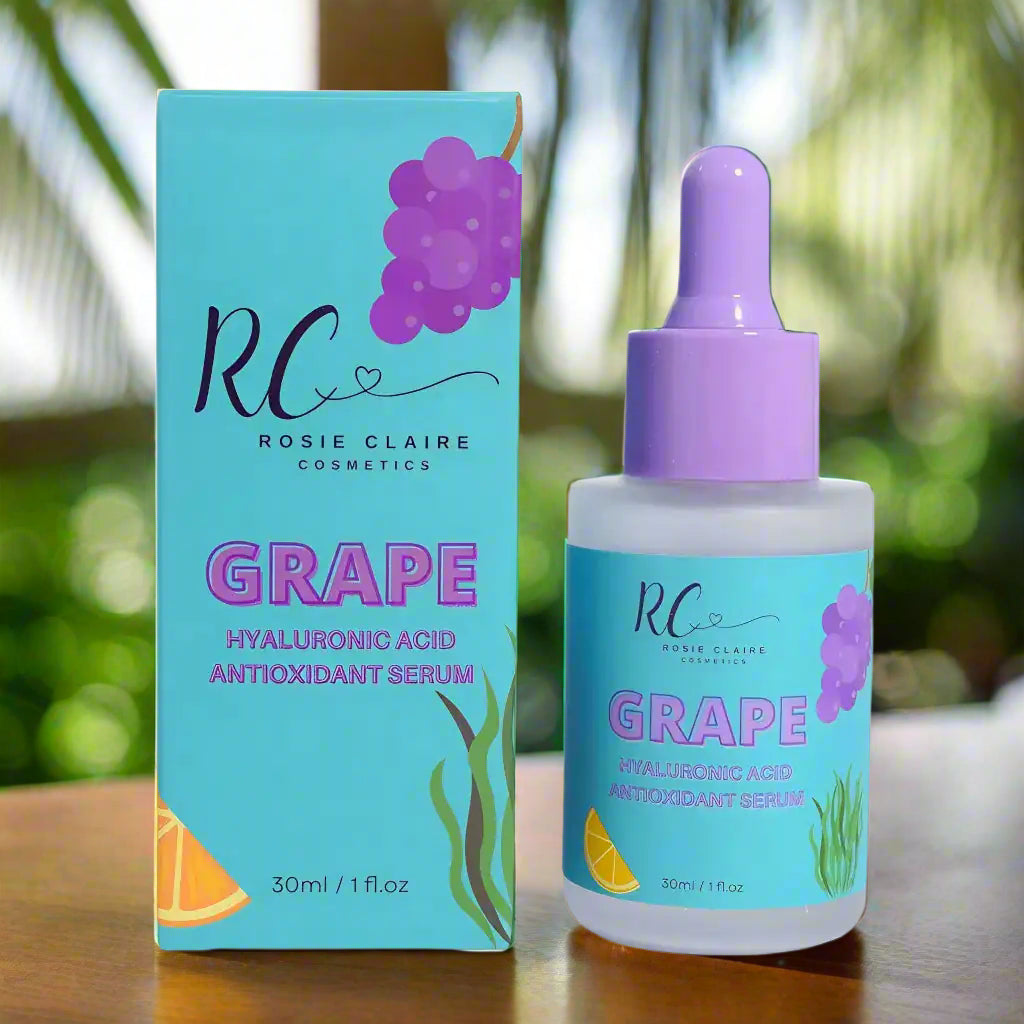 Rosie Claire Cosmetics Grape Hyaluronic Acid Antioxidant Serum packaging and serum bottle showcasing the benefits of this hyaluronic acid serum for skincare. The vibrant design features grape graphics, making it eye-catching for skincare essentials. Enjoy free shipping with Blooming Violets, a trusted vendor for skincare products infused with vitamin C, acid, and antioxidants.