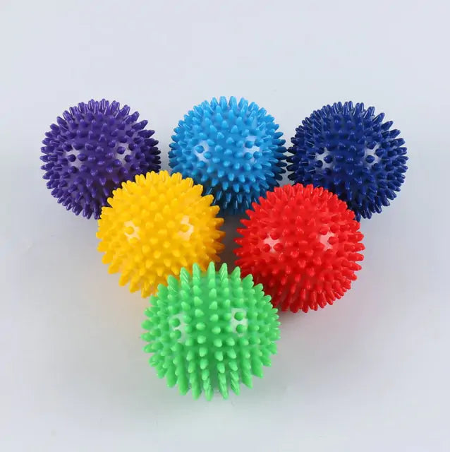 a bunch of colorful balls sitting on top of each other