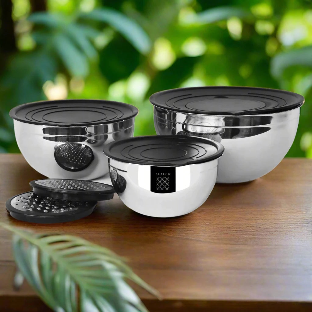 a group of pots and pans sitting on top of a wooden table