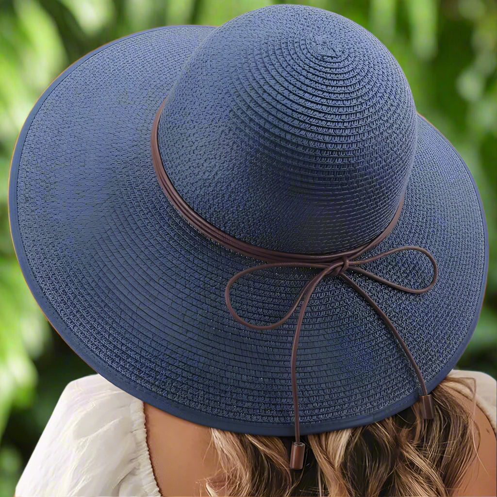 A stylish DRESHOW Womens Sun Straw Hat featuring a wide brim and a bowknot detail, perfect for summer outings. This blue straw hat from the Blooming Violets collection showcases fashionable elegance for ladies, making it a great choice for the spring season. Enjoy free shipping on this chic womens straw sun hat.