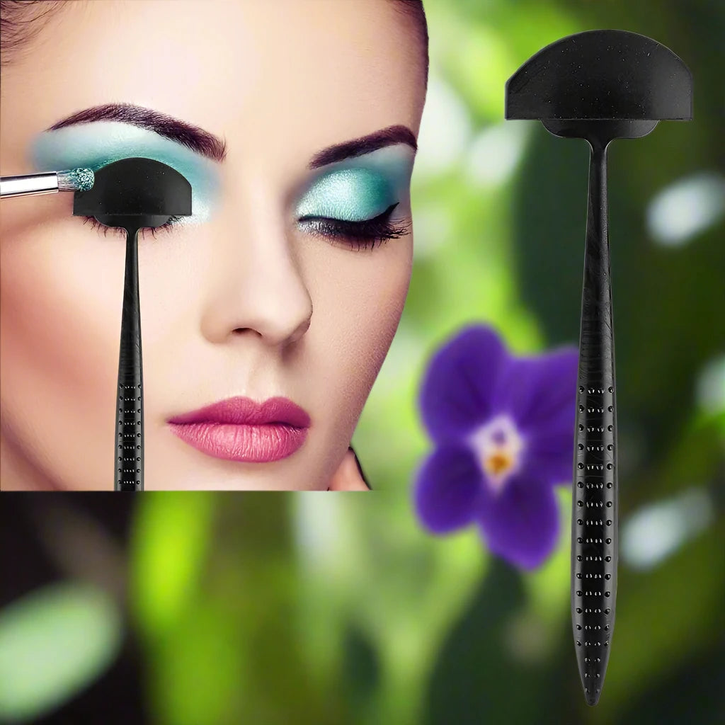 a picture of a woman with makeup and a brush