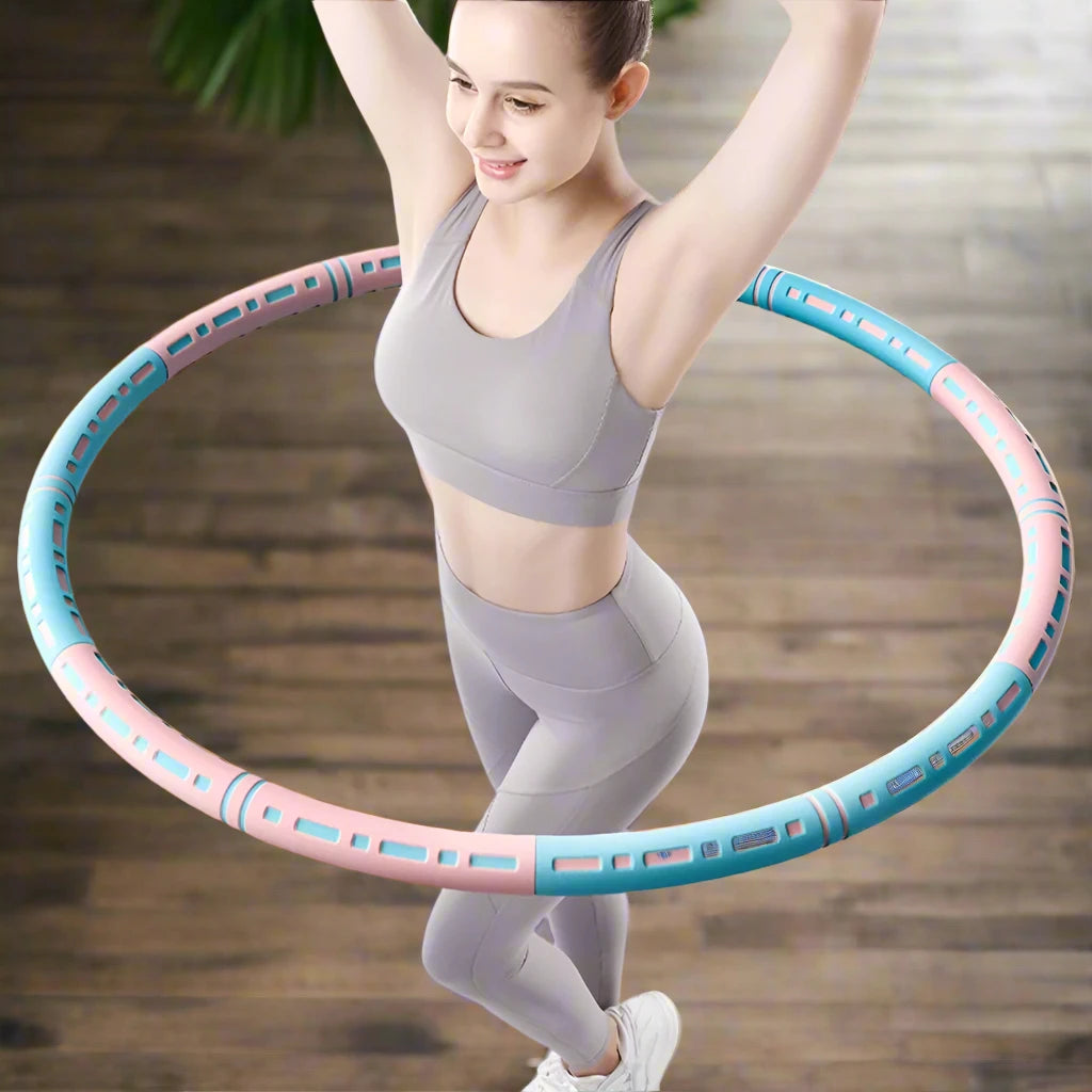 a woman is holding a hula hoop on a wooden floor