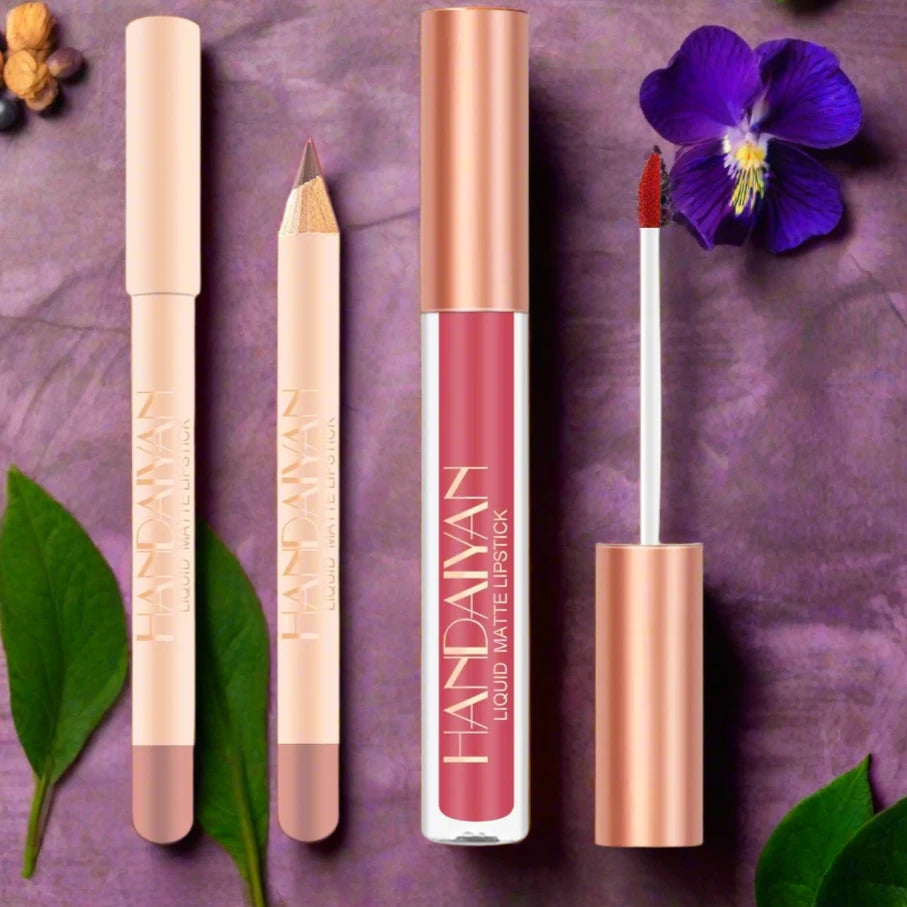 a purple table with lipstick and a flower