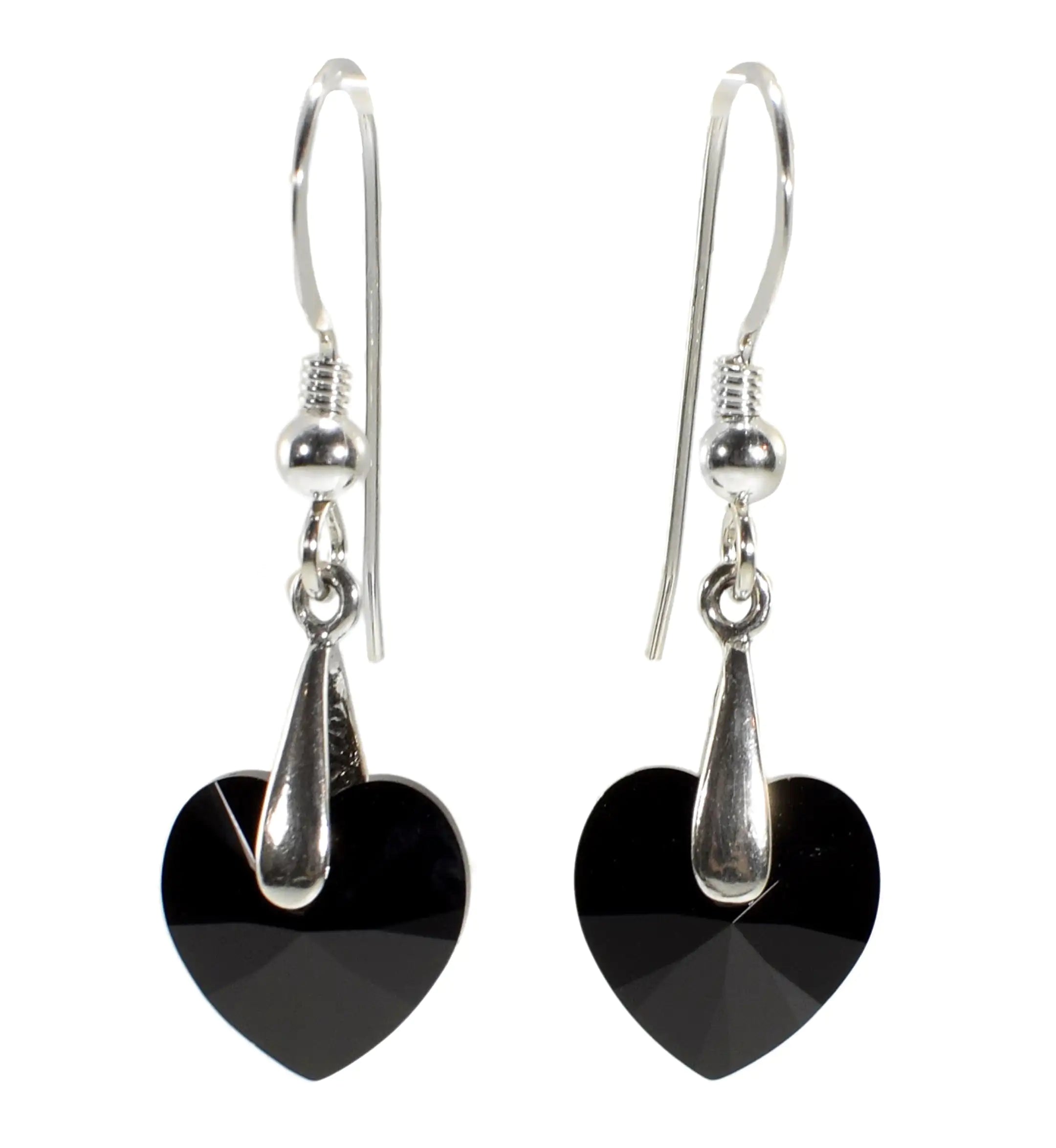 a pair of black heart shaped earrings