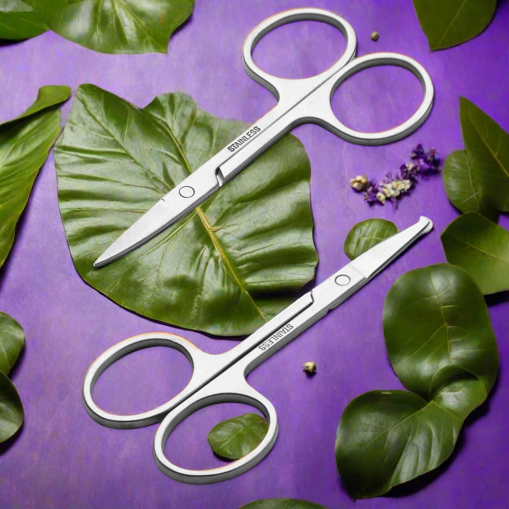 a pair of scissors sitting on top of a purple surface