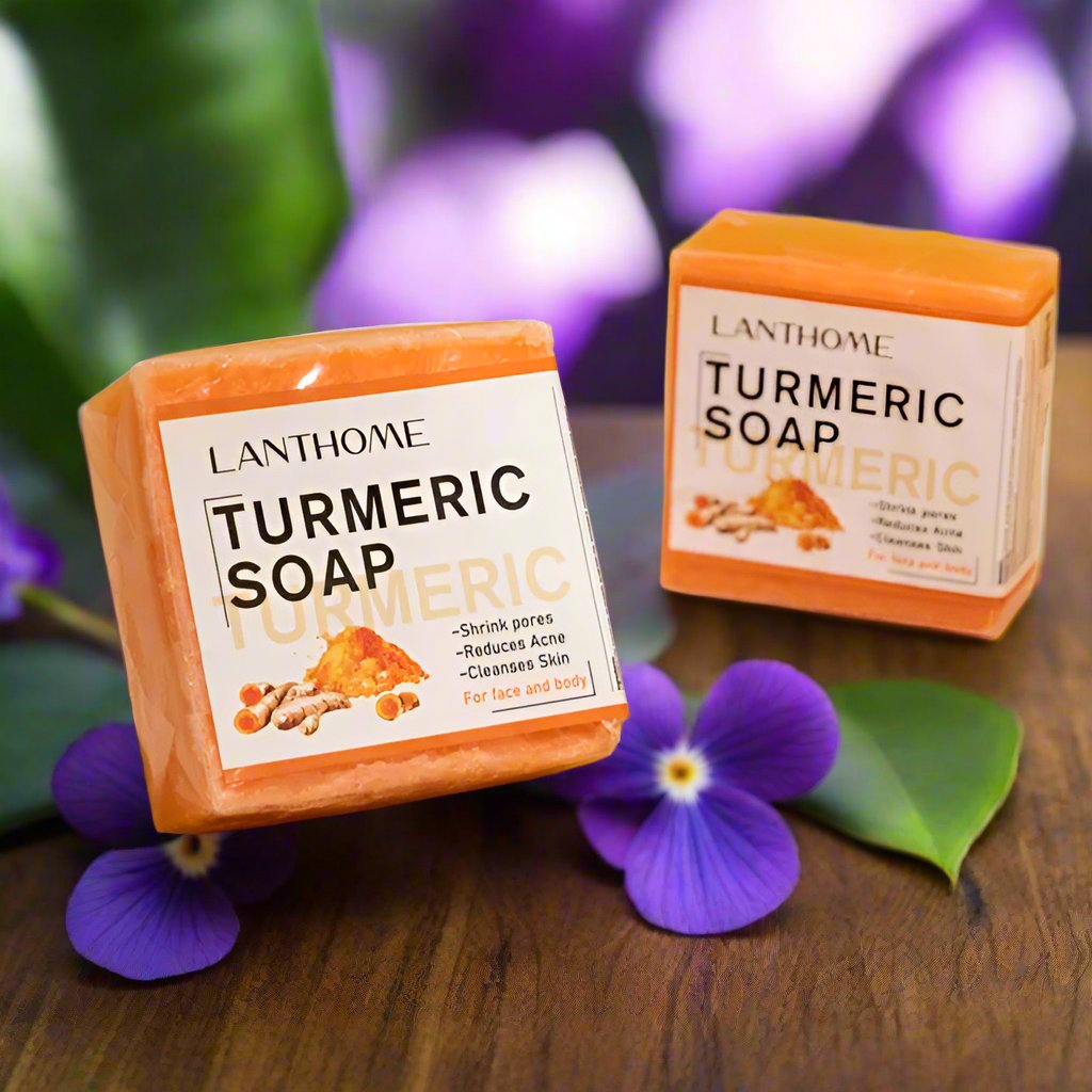 a couple of soaps sitting on top of a wooden table