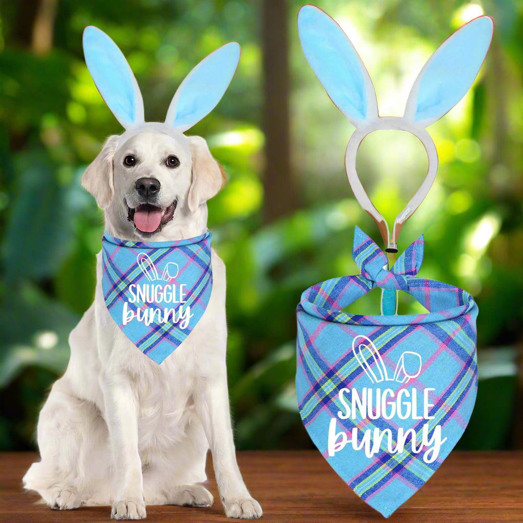 A golden retriever wearing a light blue bandana with 'Snuggle Bunny' text and blue bunny ears, showcasing adorable easter dog costumes by Blooming Violets. Perfect for pet owners looking to celebrate Easter in style! This costume includes a bandana and bunny ears for pets with free shipping.