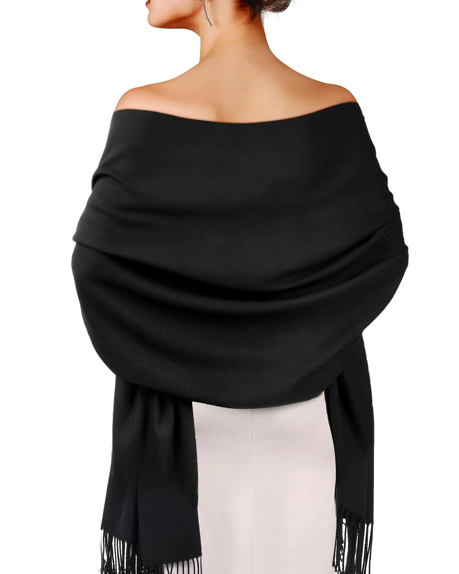 a woman wearing a black shawl with fringes