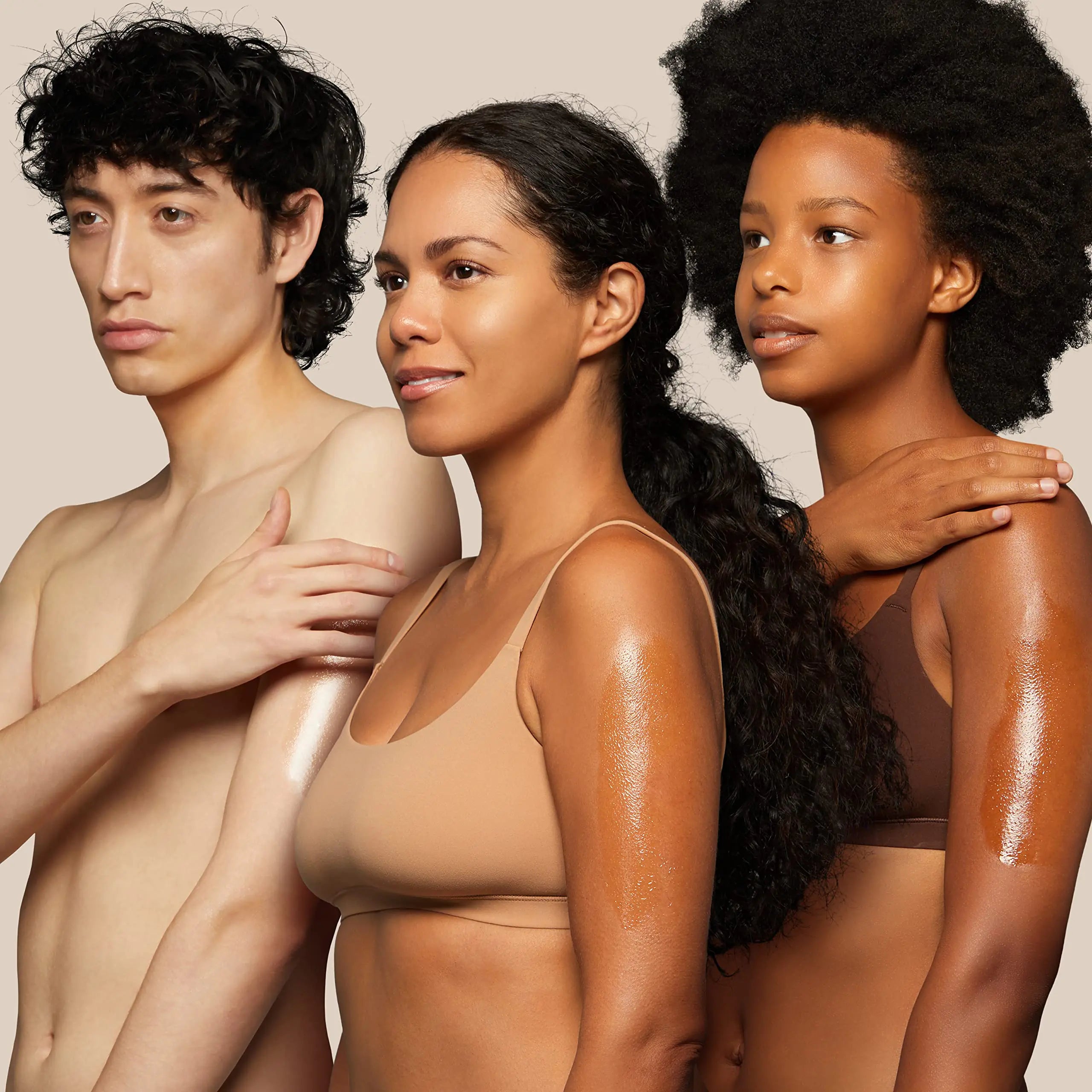 a group of three naked women standing next to each other