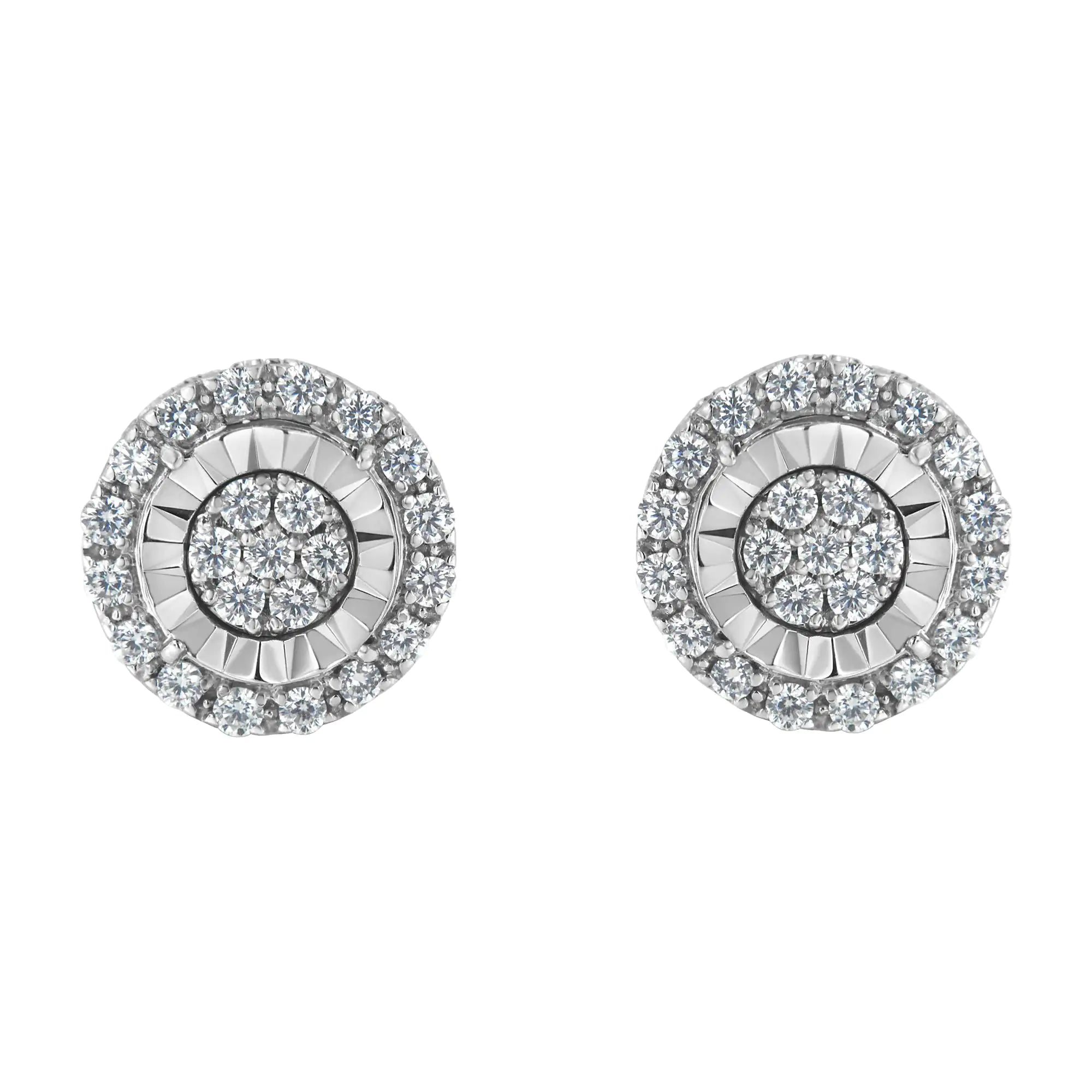 a pair of white gold and diamond earrings