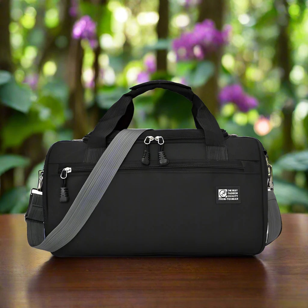 a black bag sitting on top of a wooden table