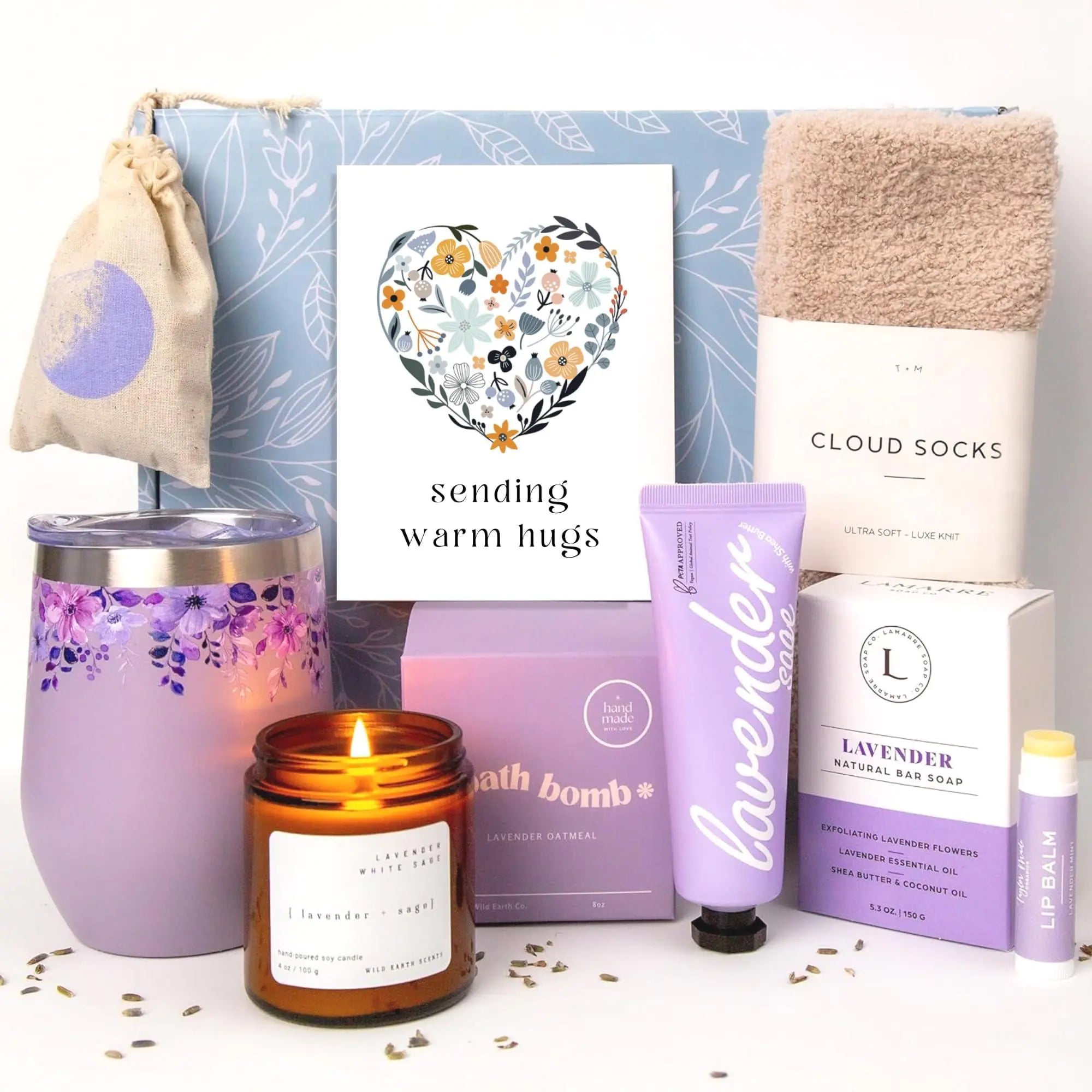 a candle, soap, and other items are on a table