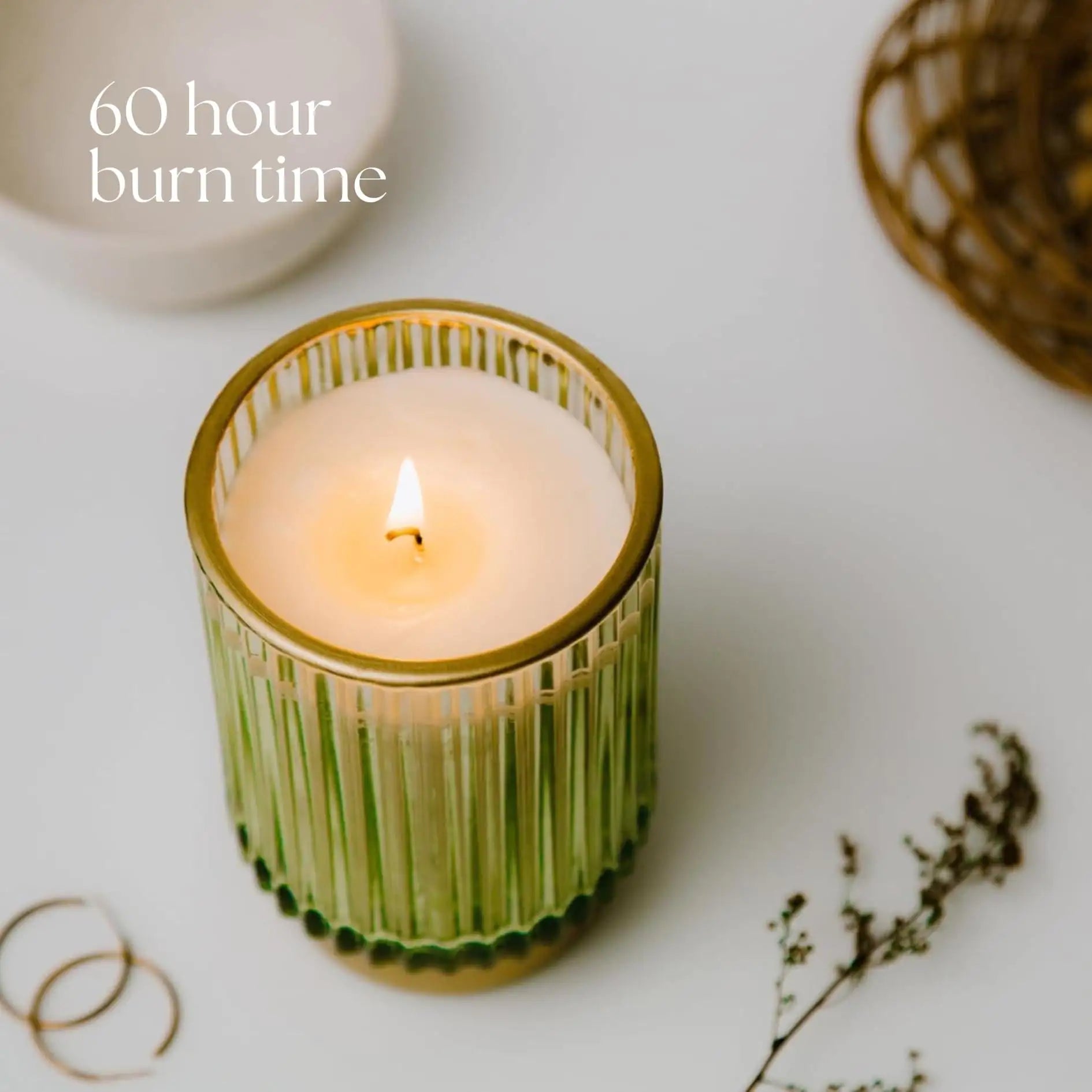 a candle sitting on top of a white table