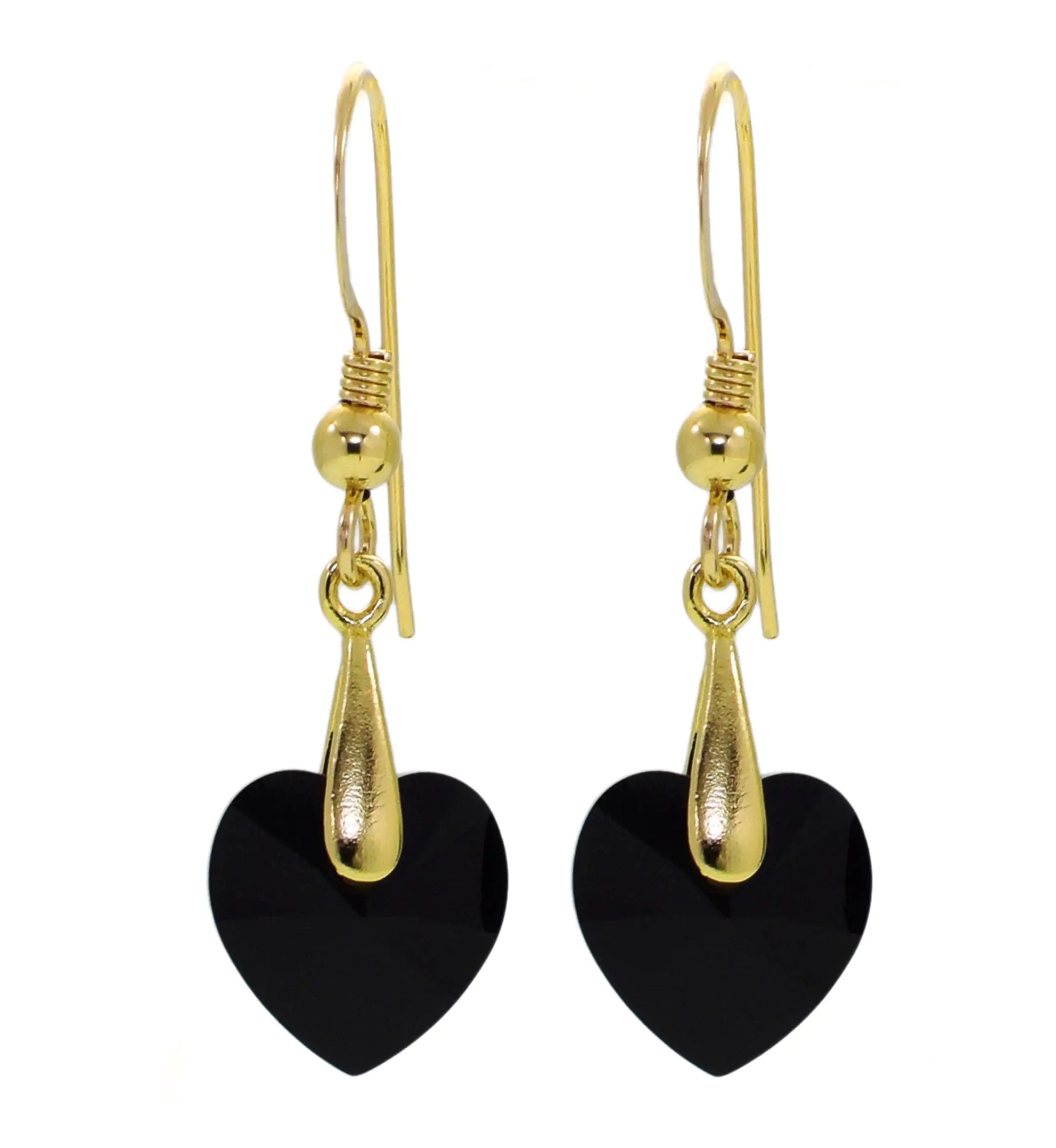 a pair of black heart shaped earrings