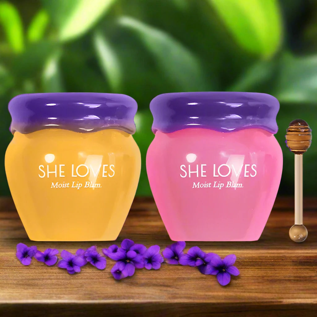 two jars of honey on a wooden table