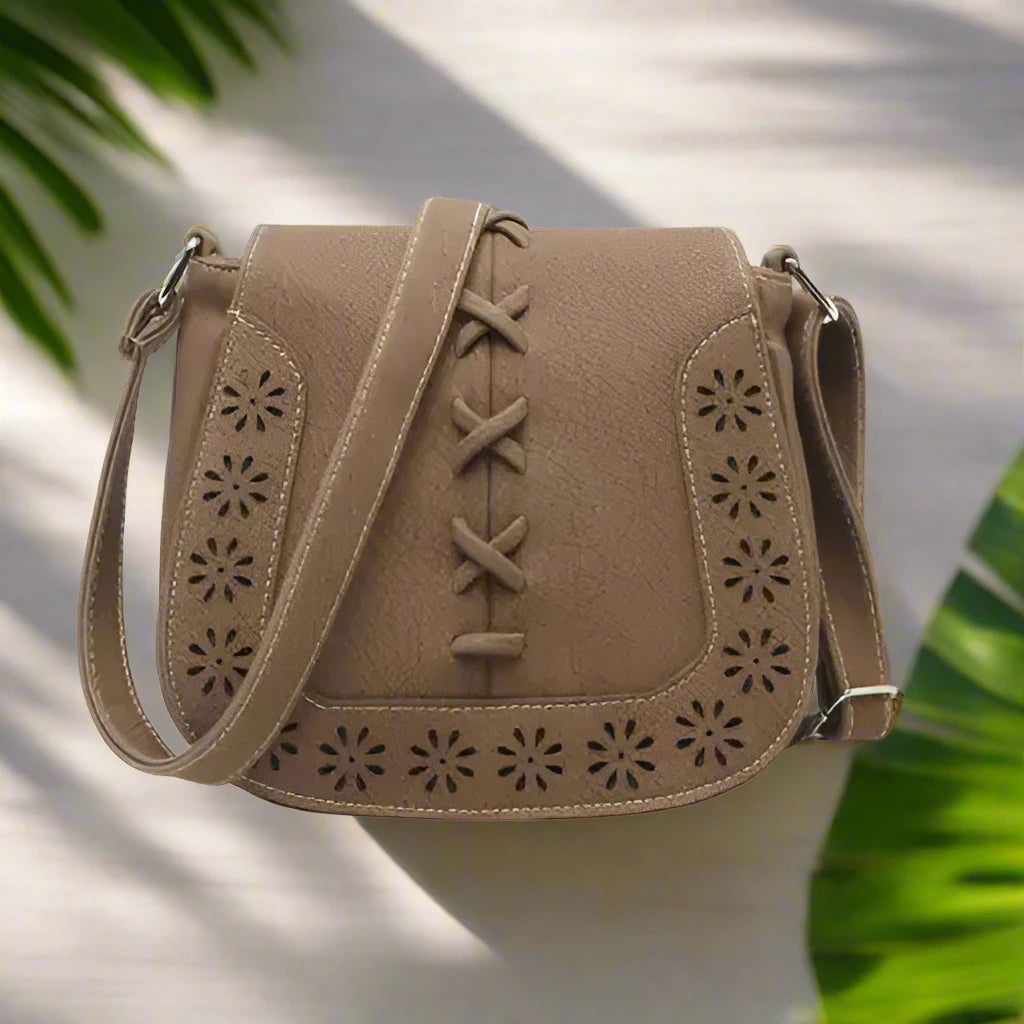 a brown purse with a cross body strap
