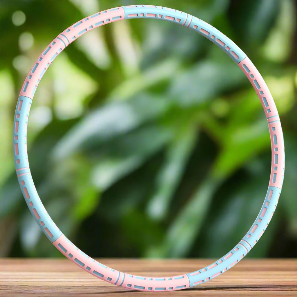 a close up of a pink and blue frisbee on a table