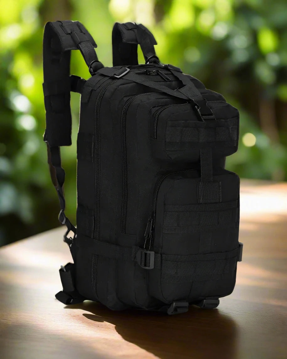 a black backpack sitting on top of a wooden table