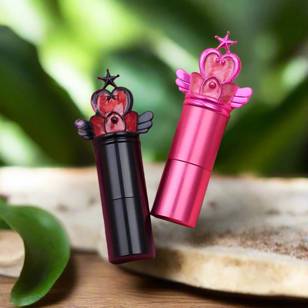 a close up of two lipsticks on a table